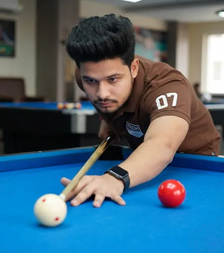 leaning over blue billiard table cue shot