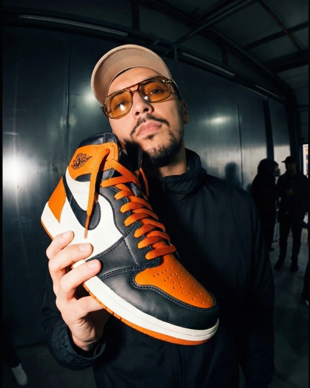 streetwear editorial holding Jordan sneaker to face